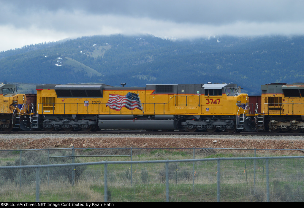 A Flag Painted UP SD90MAC Stored